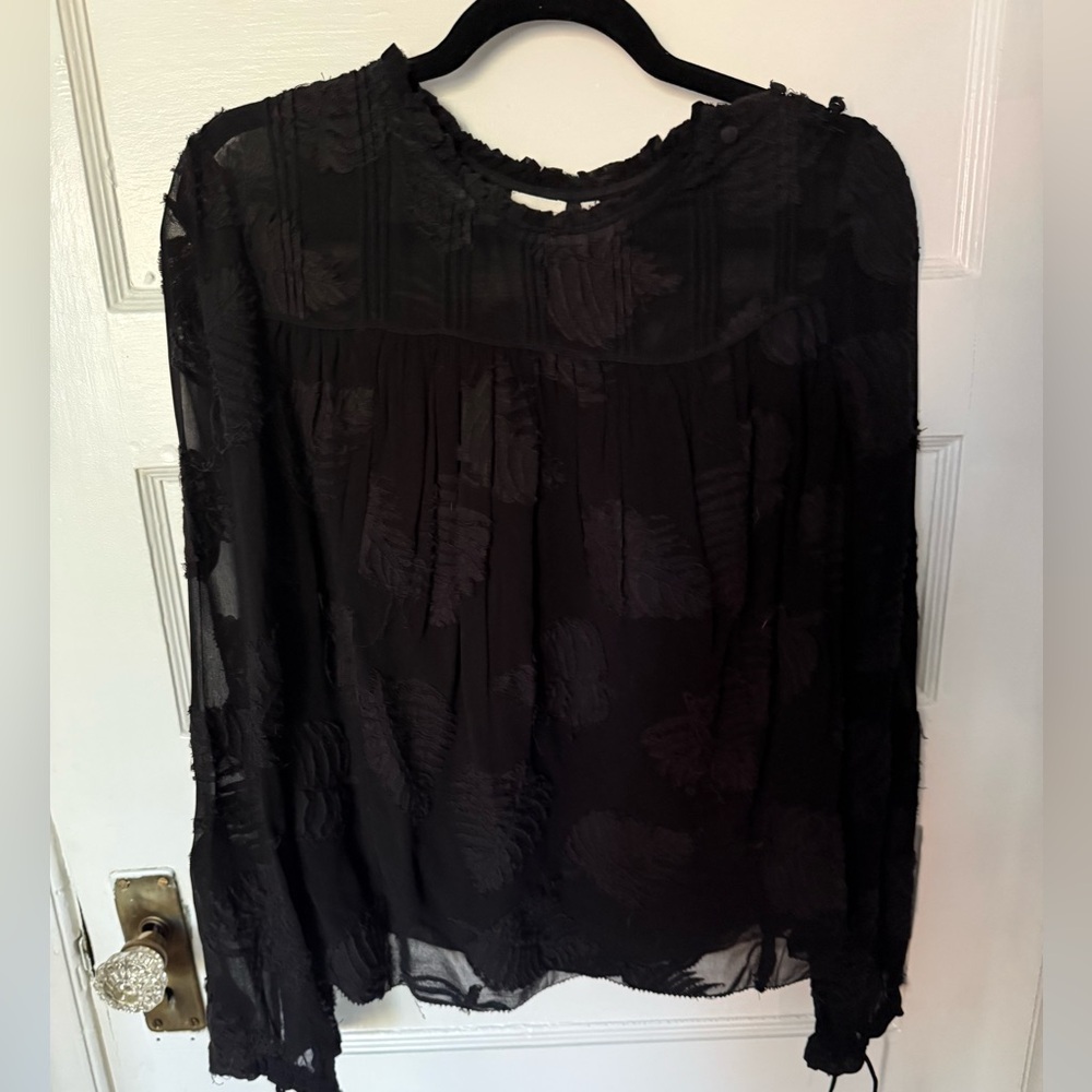 Black lacy Aritzia top with button shoulder closure